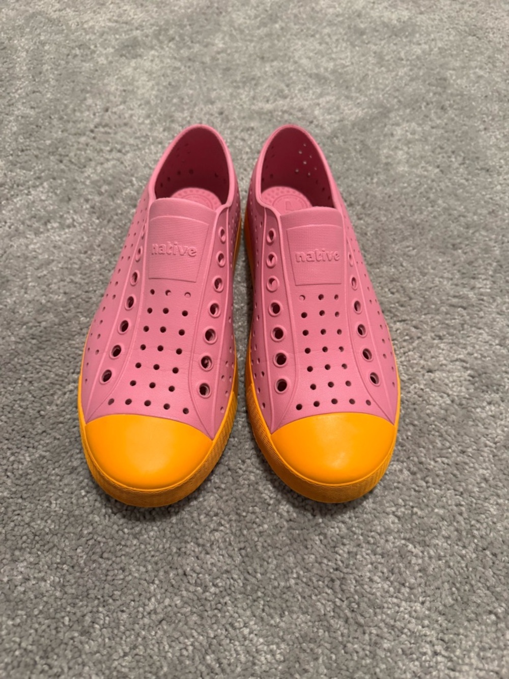 Native Shoes Jefferson slip-on water shoes in a pink and orange colorway